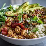 Ground turkey bowl with colorful roasted veggies and a squeeze of lime for a fresh, balanced weeknight meal.  