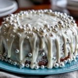 Moist vanilla sheet cake elegantly covered in shimmering pearl fondant for a Communion party.